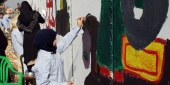 رسومات لمدرسة عيسى بن مريم على الجدار الفاصل  من وحي عاشوراء